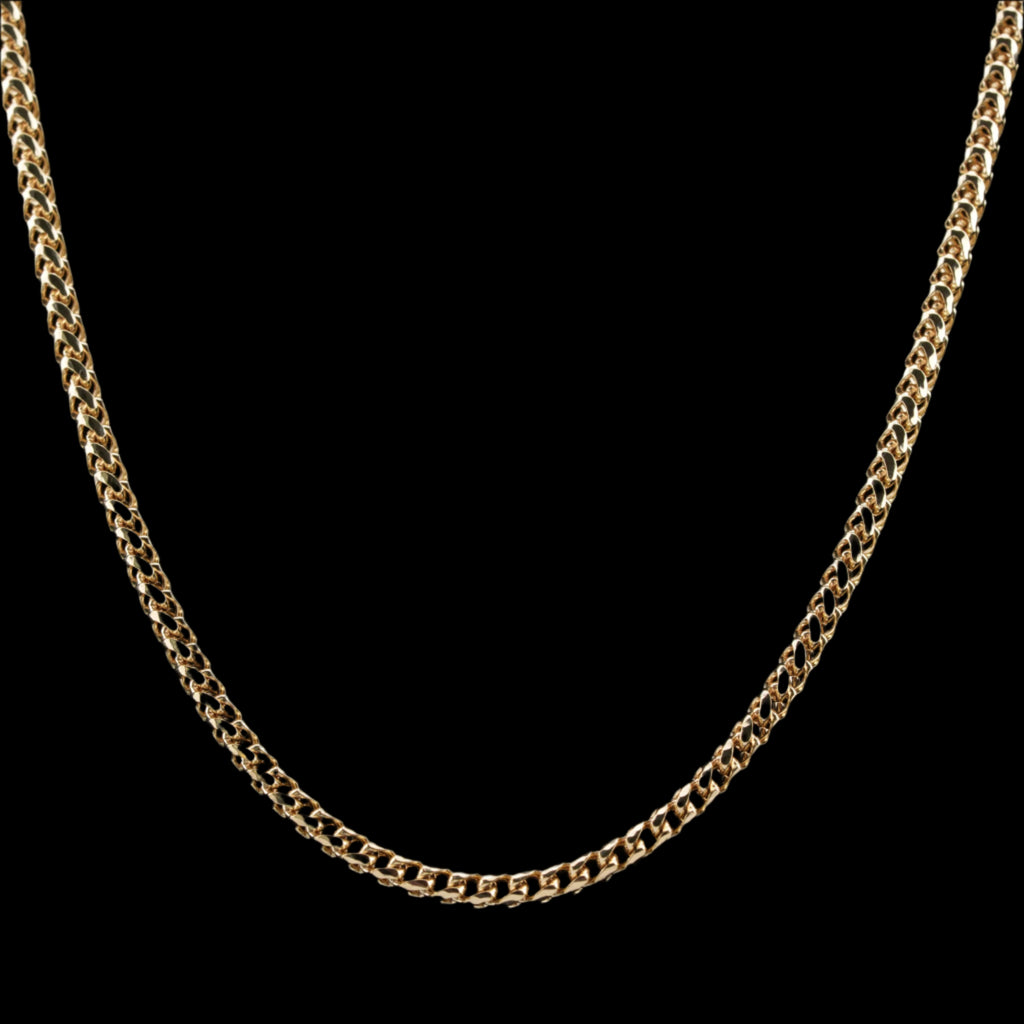 2.5mm diamond-cut franco solid gold chain on a black background