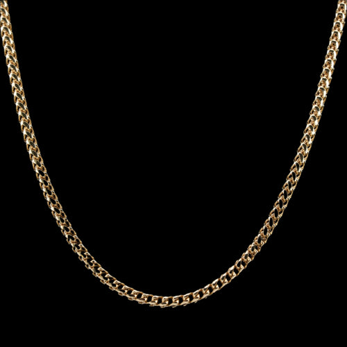2.5mm diamond-cut franco solid gold chain on a black background