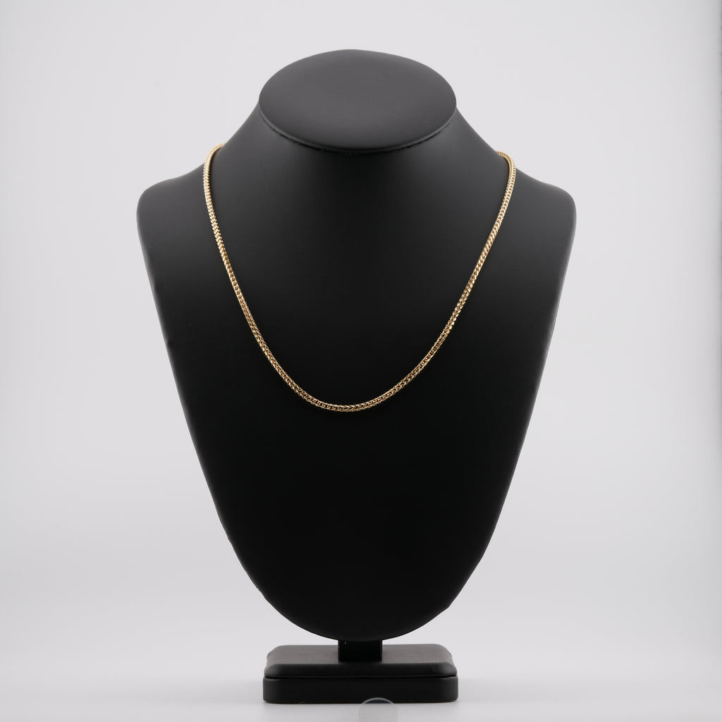 2.5mm diamond-cut franco solid gold chain on a neck display