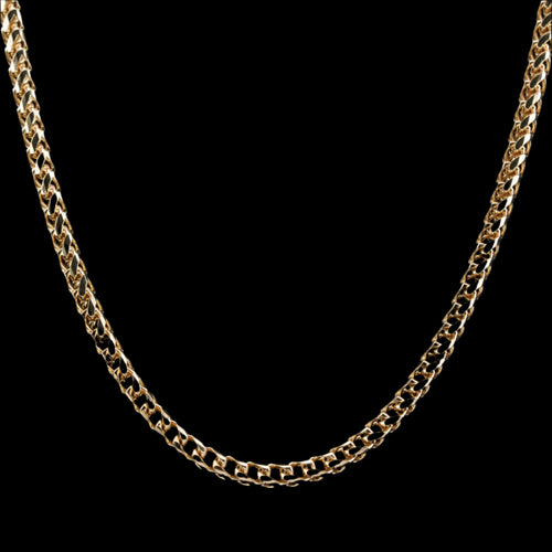 3mm diamond-cut franco solid gold chain on a black background