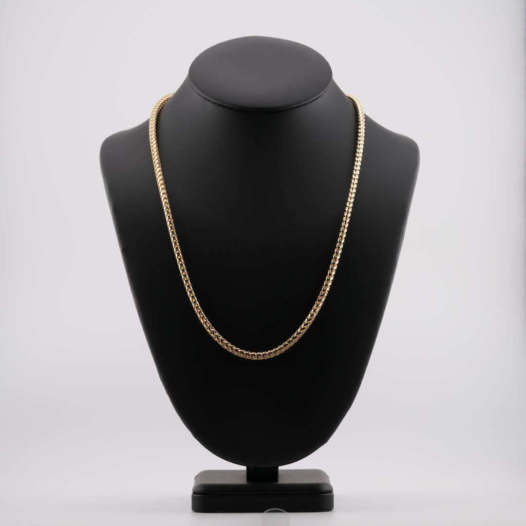4mm diamond-cut franco solid gold chain on a neck display