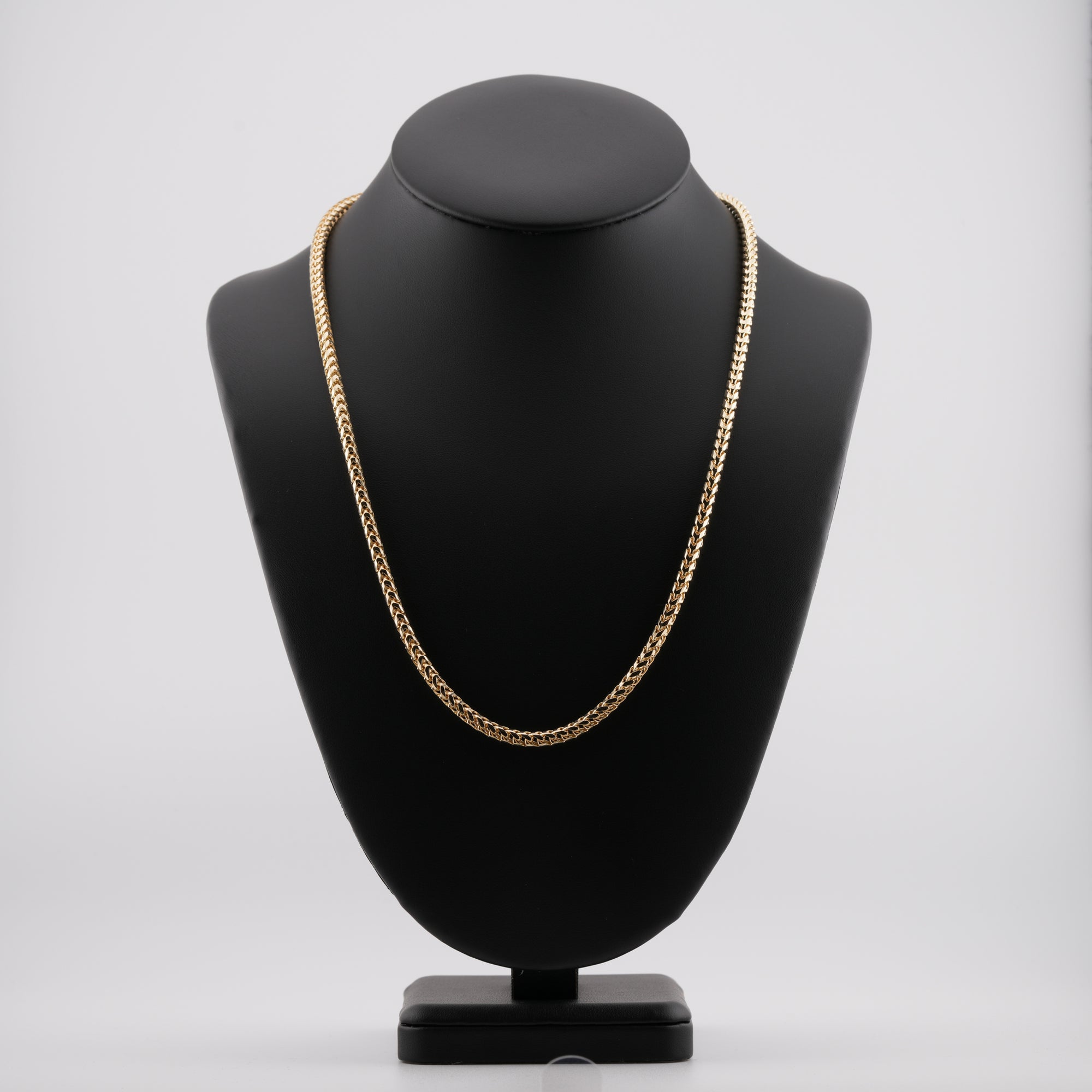 4mm diamond-cut franco solid gold chain on a neck display