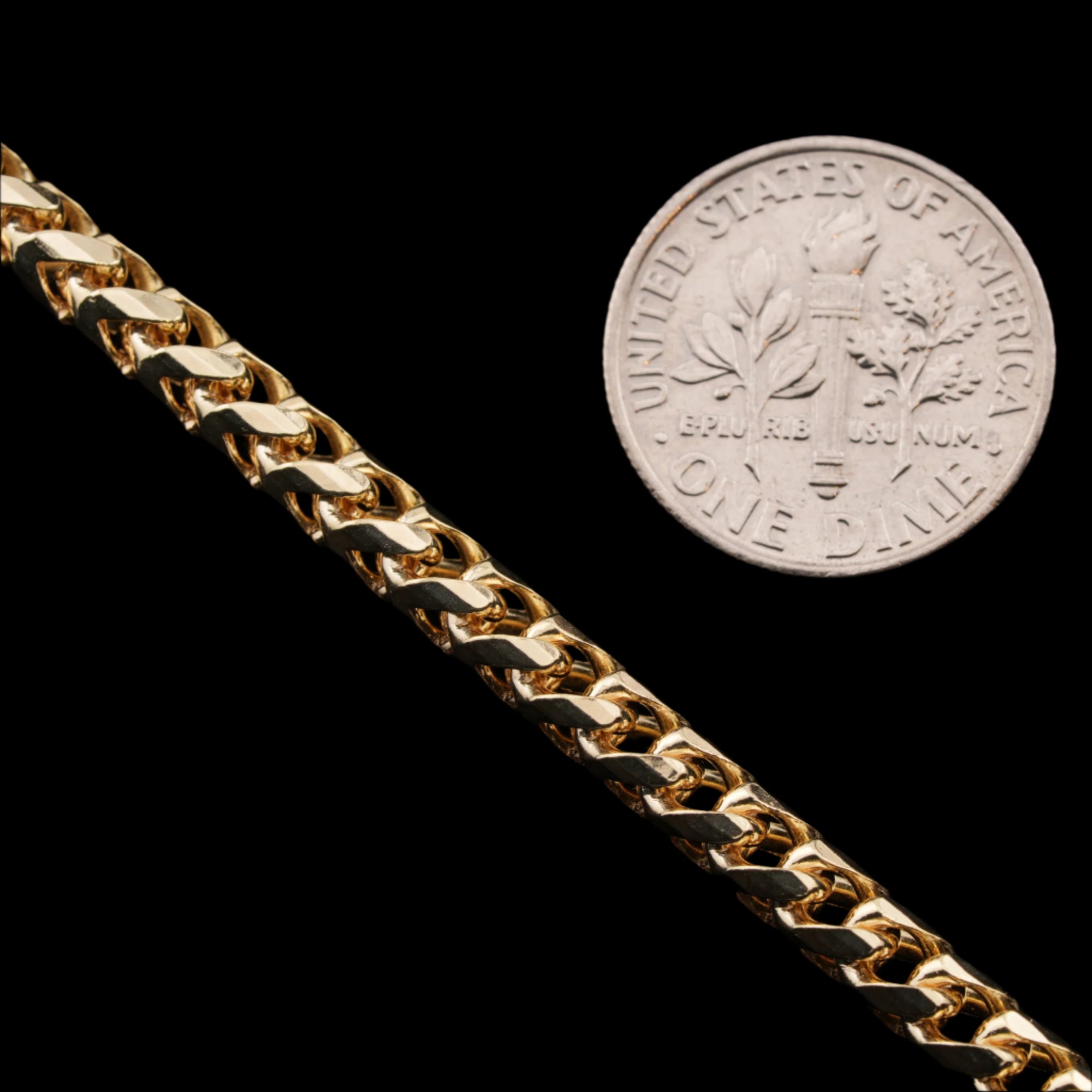 4mm diamond-cut franco solid gold chain next to a dime for size comparison