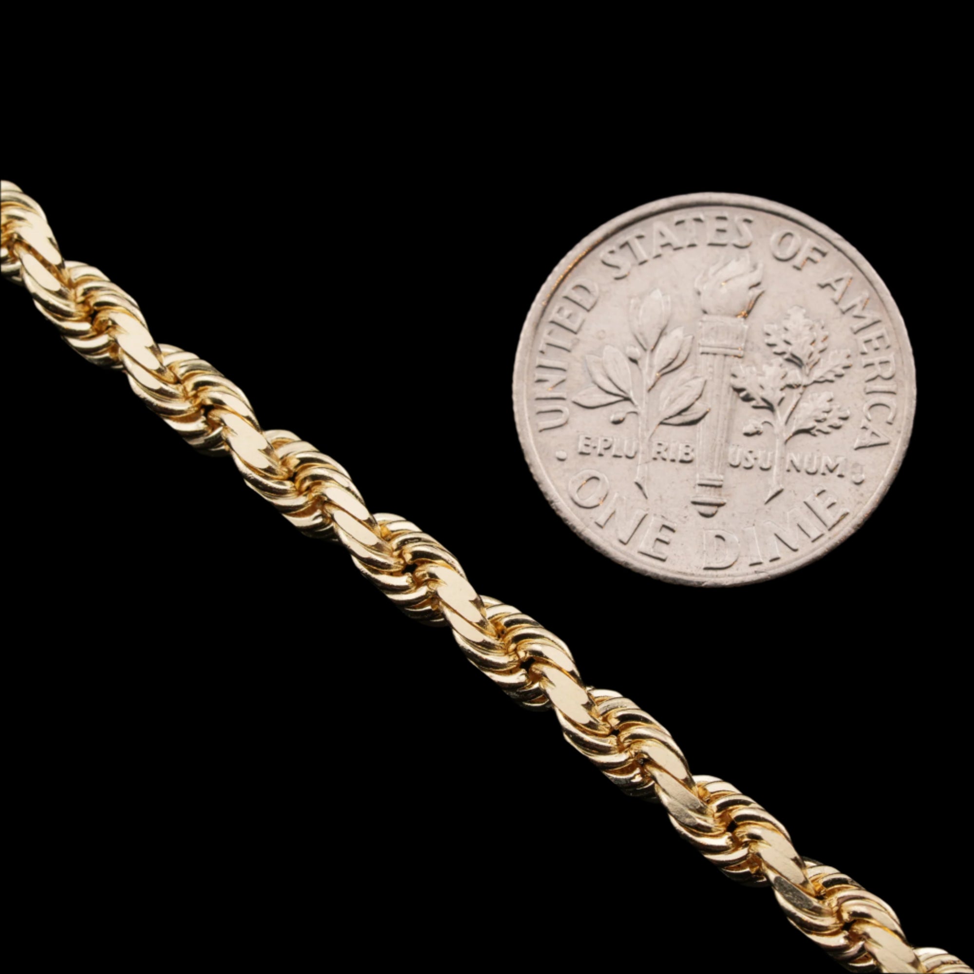 4mm diamond-cut rope solid gold chain next to a dime for size comparison