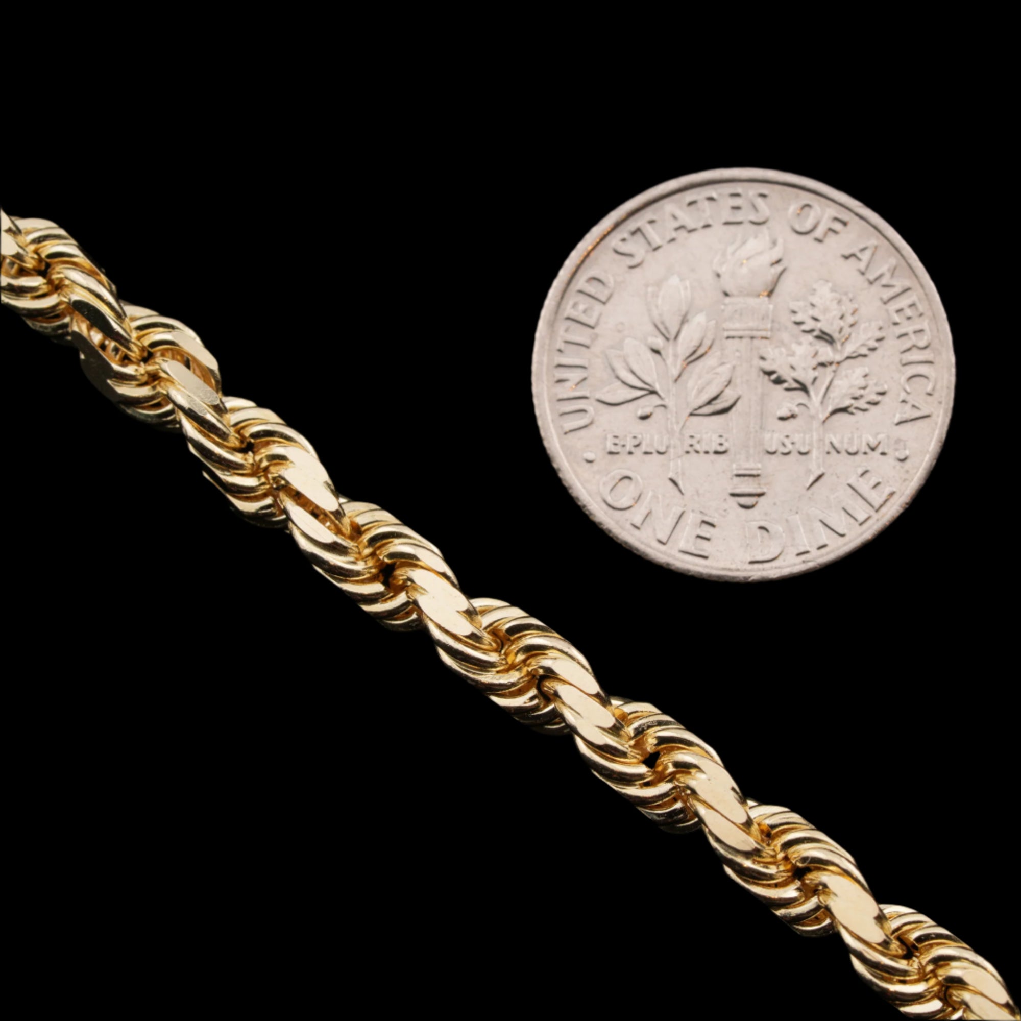 5mm diamond-cut rope solid gold chain next to a dime for size comparison